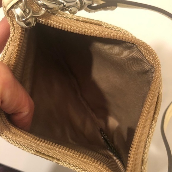 Coach brown creamy white signature stripe wristlet
